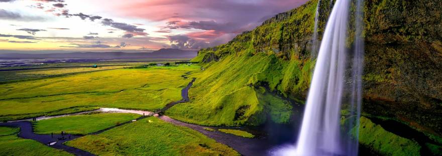 time lapse photography of waterfalls during sunset